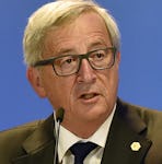 European Commission President Jean-Claude Juncker talks to the media after the emergency EU heads of state summit on the migrant crisis at the EU council building in Brussels on early Thursday, Sept. 24, 2015. European Union leaders, faced with a staggering migration crisis and deep divisions over how to tackle it, managed to agree early Thursday to send 1 billion euros ($1.1 billion) to international agencies helping refugees at camps near their home countries. (AP Photo/Martin Meissner)