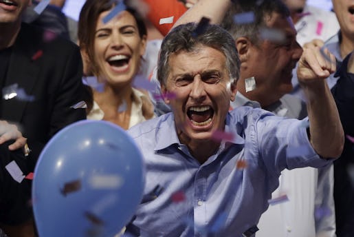 Opposition presidential candidate Mauricio Macri and his wife Juliana Awada, back left, celebrate after winning a runoff presidential election in Buenos Aires, Argentina, Sunday, Nov. 22, 2015.  Macri won Argentina's historic runoff election against ruling party candidate Daniel Scioli, putting an end to the era of  President Cristina Fernandez, who along with her late husband dominated Argentine politics for 12 years. (AP Photo/Ricardo Mazalan)