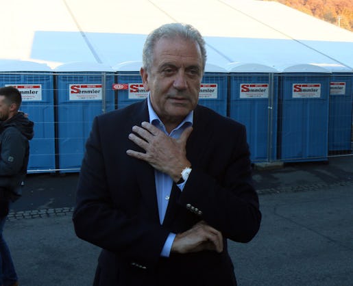 EU Commissioner for Migration and Home Affairs Dimitris Avramopoulos speaks to media during a visit with Austrian Interior Minister Johanna Mikl-Leitner at the border between Slovenia and Austria in Spielfeld, Austria, Friday, Nov. 6, 2015. The Austrian Interior Ministry says that 56,356 people applied for asylum between January and September, representing a 231-percent jump over the same period last year. (AP Photo/Ronald Zak)