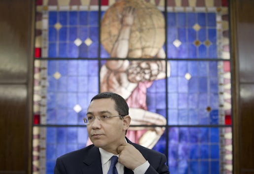 FILE - In this Tuesday, June 9, 2015 file photo Romanian Prime Minister, Victor Ponta, adjusts his collar during a meeting with foreign media at the government headquarters in Bucharest. Romanian Prime Minister Victor Ponta has resigned following protests over the deadly Bucharest nightclub fire. (AP Photo/Vadim Ghirda, File)