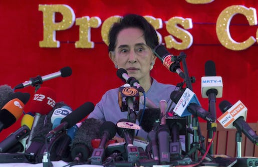 Myanmar's opposition leader Aung San Suu Kyi addresses the media at a press conference at her home in Yangon, Myanmar, Thursday, Nov. 5, 2015. On Sunday Myanmar will hold what is being viewed as the country's best chance for a free and credible election in a quarter of a century.(AP Photo/Mark Baker)