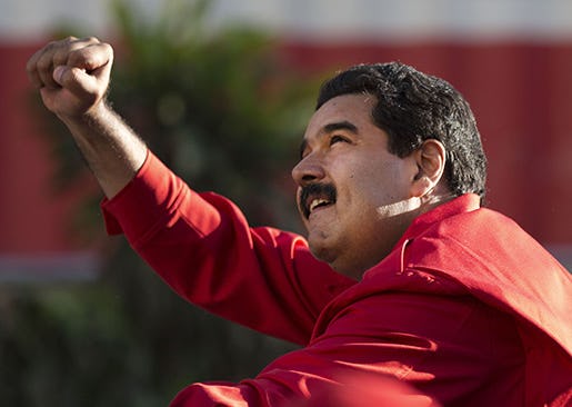 FILE - In this Dec. 1, 2015, file photo, Venezuela's President Nicolas Maduro gestures to supporters from the top of a car after the inauguration of cable car public transportation system, in the popular neighborhood of Petare, in Caracas, Venezuela. Allies of President Maduro are disputing the election of eight opposition candidates to the National Assembly, a move the opposition says seeks to undermine its landslide victory in legislative elections. On Tuesday, Dec. 29, 2015, the Supreme Court said it had received motions by losing candidates to overturn the results in several districts.(AP Photo/Ariana Cubillos, File)