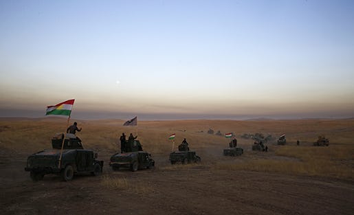 A Peshmerga convoy drives towards a frontline in Khazer, about 30 kilometers (19 miles) east of Mosul, Iraq, Monday, Oct. 17, 2016.   The Iraqi military and the country's Kurdish forces say they launched operations to the south and east of militant-held Mosul early Monday morning. (AP Photo/Bram Janssen)