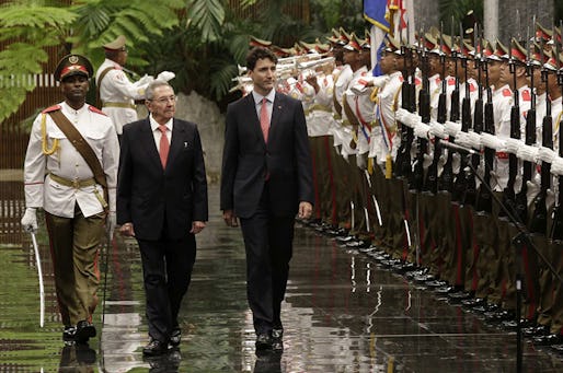 Cuba's President Raul Castro, left, and Canada Prime Minister Justin Trudeau,  review troops during a welcoming ceremony at Revolution Palace in Havana, Cuba, Tuesday, Nov. 15, 2016. Trudeau is on a two-day official visit to Cuba .(Enrique de la Osa/Pool via AP)