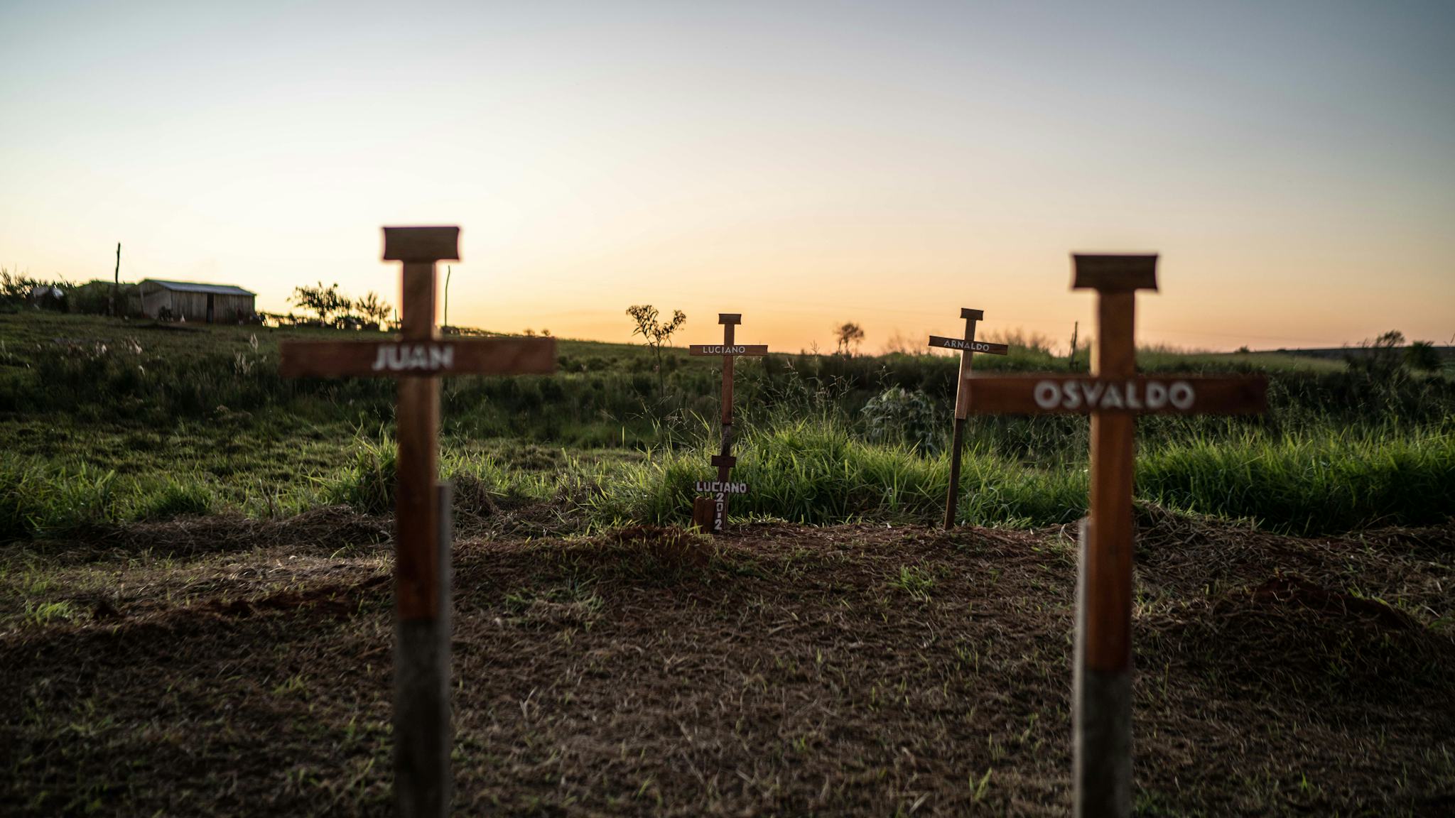 Crosses bearing the names of those kkilled in the massacre stand outside Curuguaty