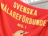 Flagga från Svenska Målareförbundet – Målarna går in i Byggnads