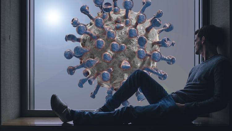 En person sitter i ett fönster och tittar ut på En illustration av det nya coronaviruset