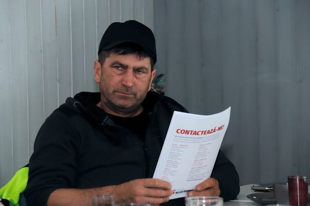 Claudiu Fărcaș holding some papers